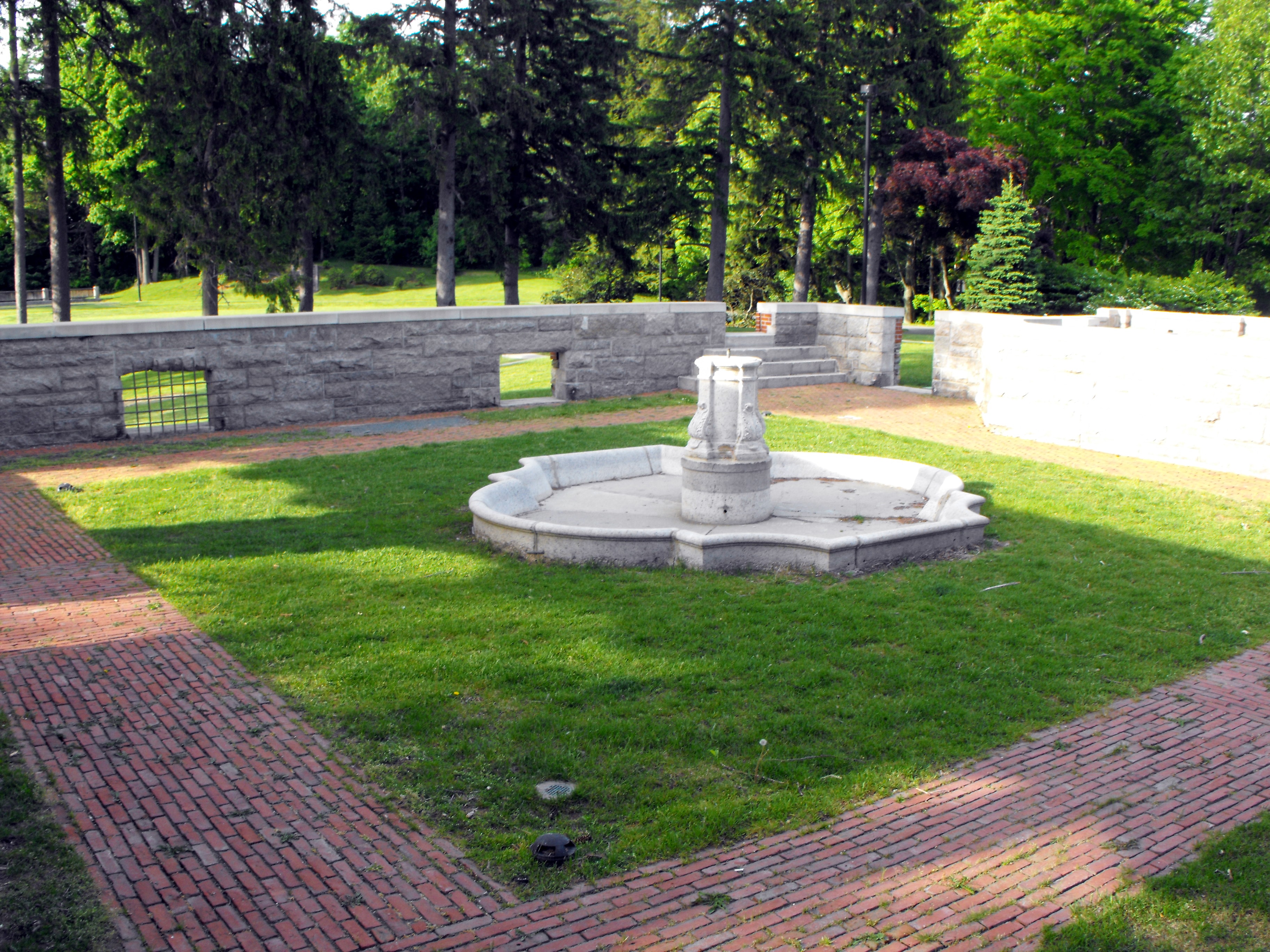 The stone-walled courtyard and fountain at Greycourt State Park in Methuen